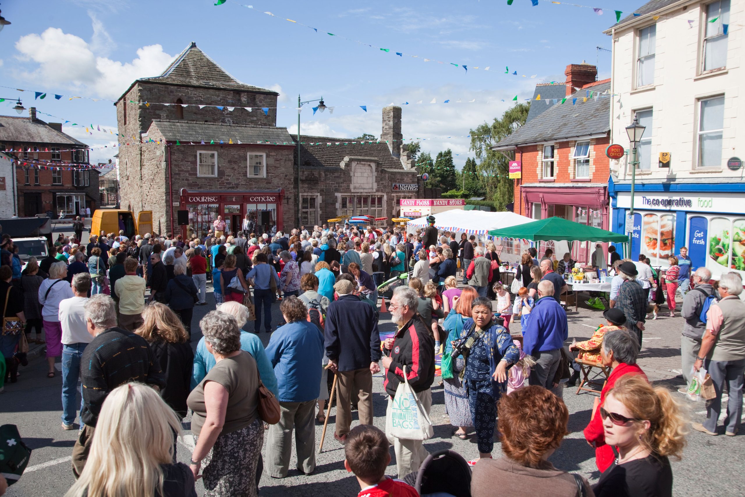 BRMJNM People in town street at festival Talgarth Wales UK